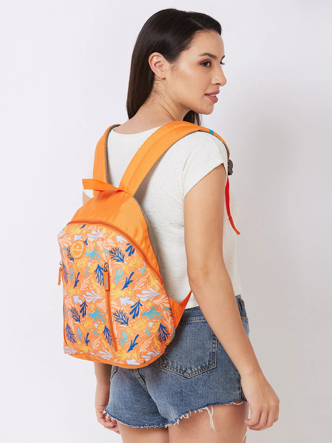 Caprese Xenia Medium Orange Printed Backpack - Image 7